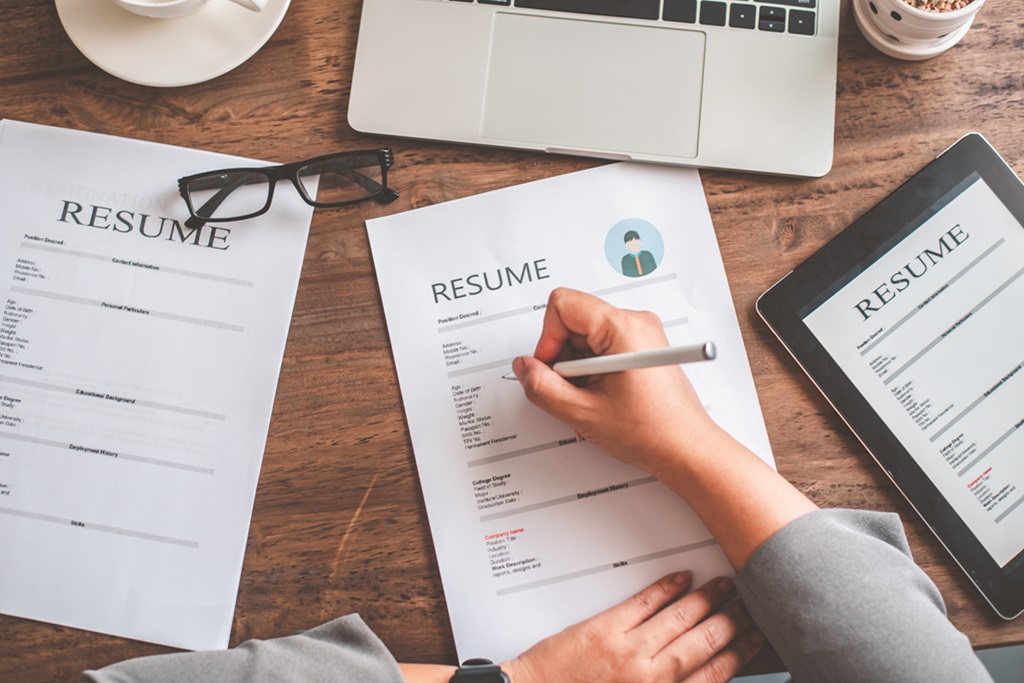 hiring manager reviewing the data analyst resume​ examples