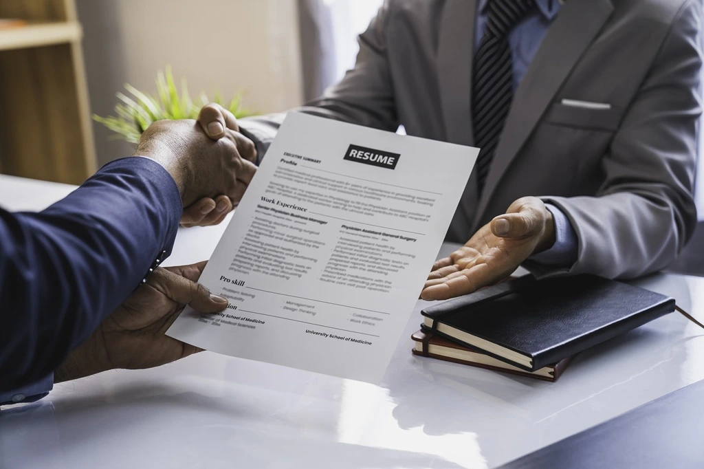 job applicant presenting their AI Engineer Resume Example in an interview