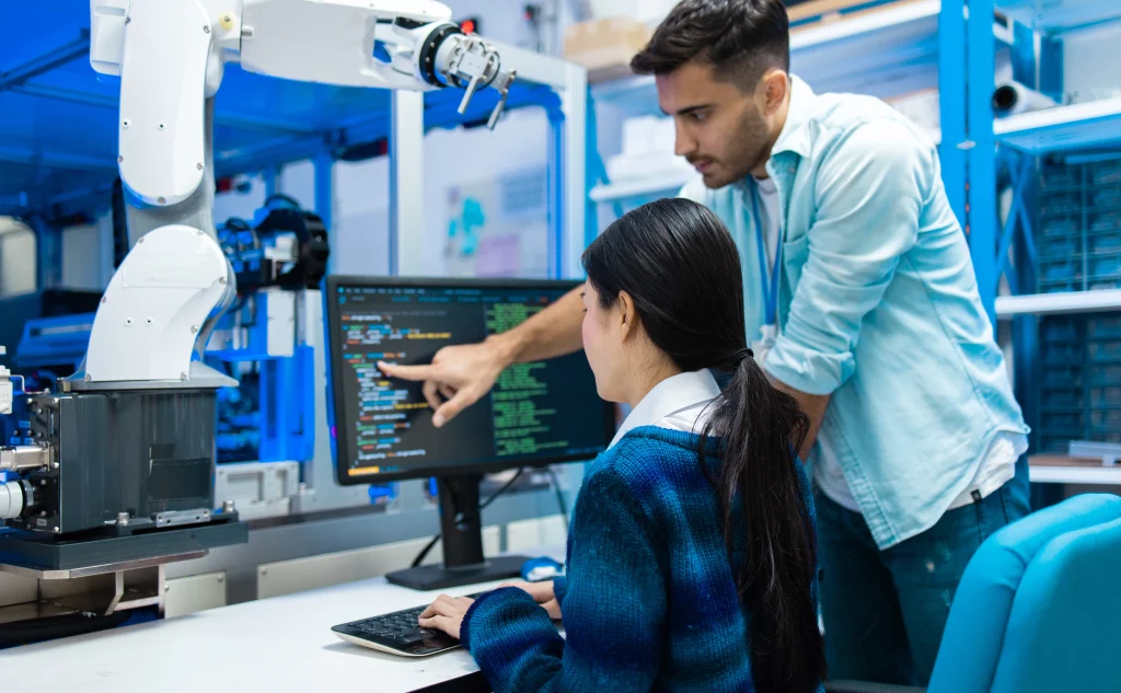 professionals working on robot automation system