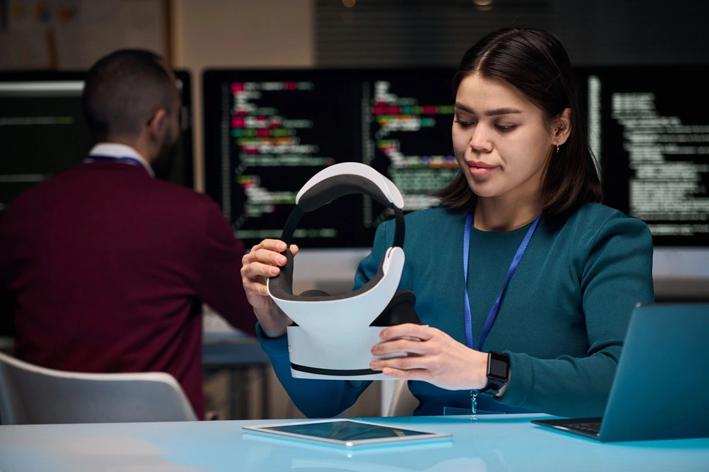 woman configuring VR equipment to highlight technical expertise for an AI engineer resume