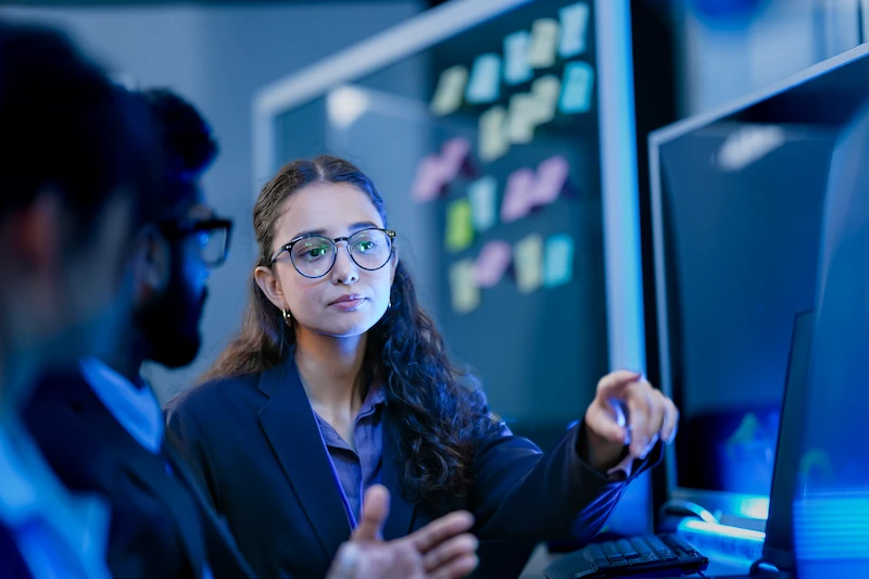 woman listening to data presentation